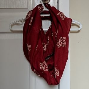Red infinity scarf with maple leaf embroidery